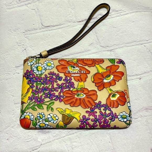 Coach Handbags - COACH Corner Zip Wristlet In Brown Signature Canvas With Wildflower Print NWT